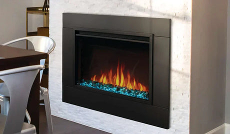 Wall-mounted electric fireplace with blue decorative stones and flames.